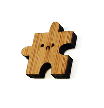 Load image into Gallery viewer, Bamboo Pin - Sad puzzle piece (innie)
